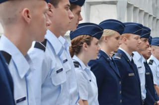 Air Force ROTC Cadets stand in formation, facing off-camera.